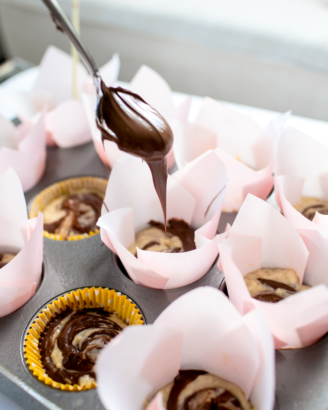 Nutella swirled onto Banana Nutella Muffins