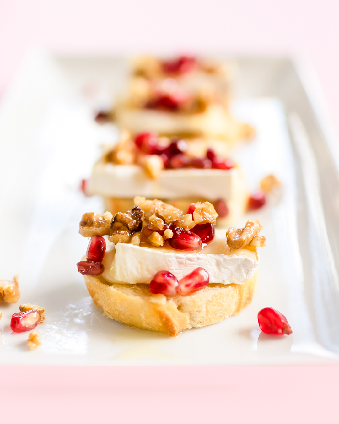 brie honey pomegranate crostini with caramelized walnuts