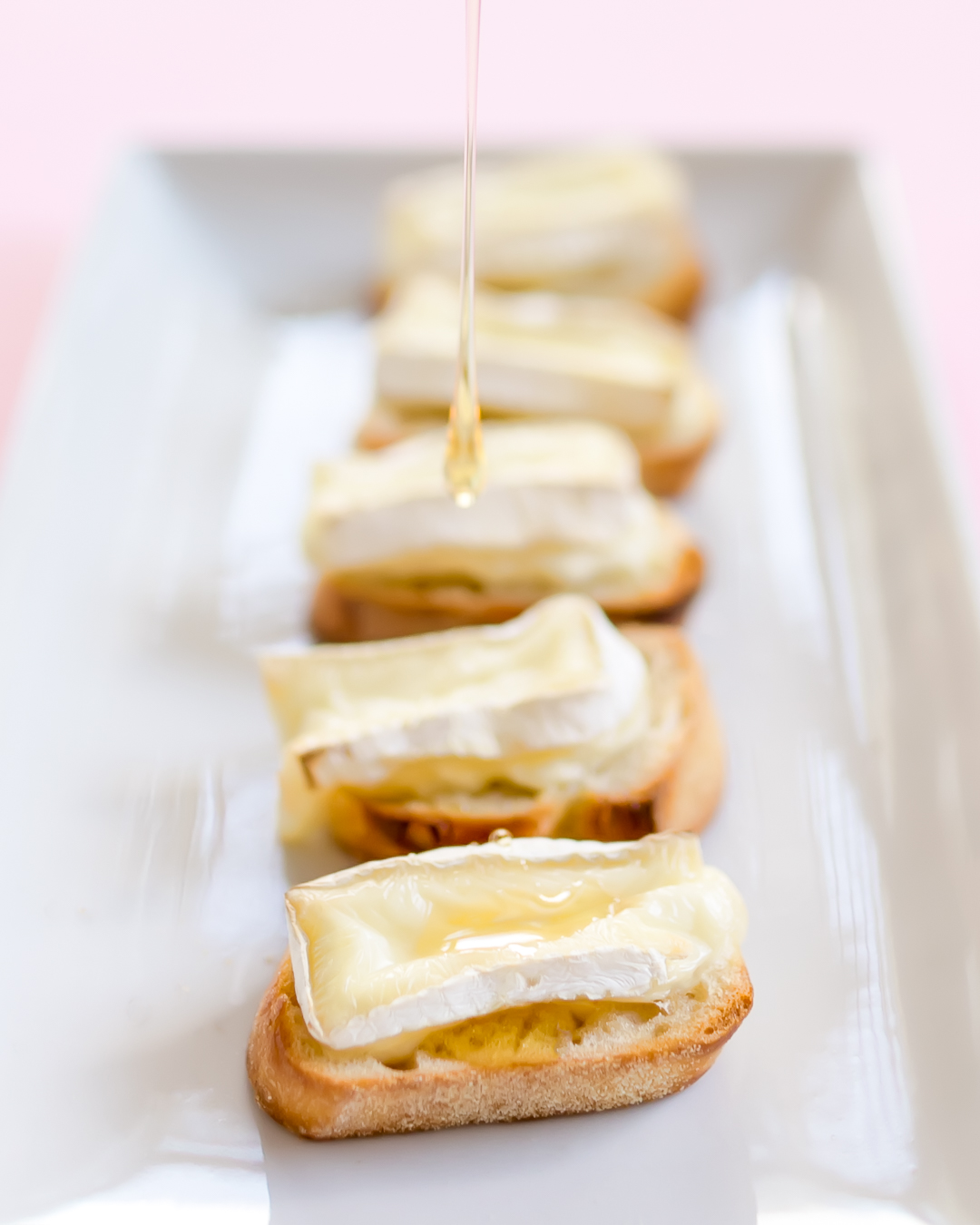 brie honey pomegranate crostini with caramelized walnuts