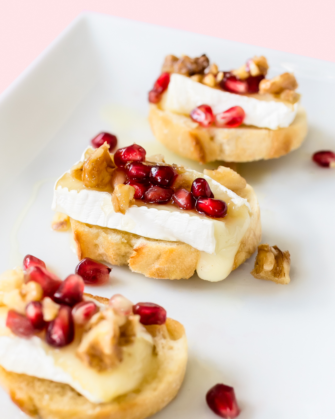 brie honey pomegranate crostini with caramelized walnuts