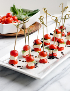 Easy Tomato and Basil Caprese Skewers make an awesome easy appetizer! They are incredibly easy to put together and will be eye catching (and delicious) for your next gathering.| www.chicandsugar.com